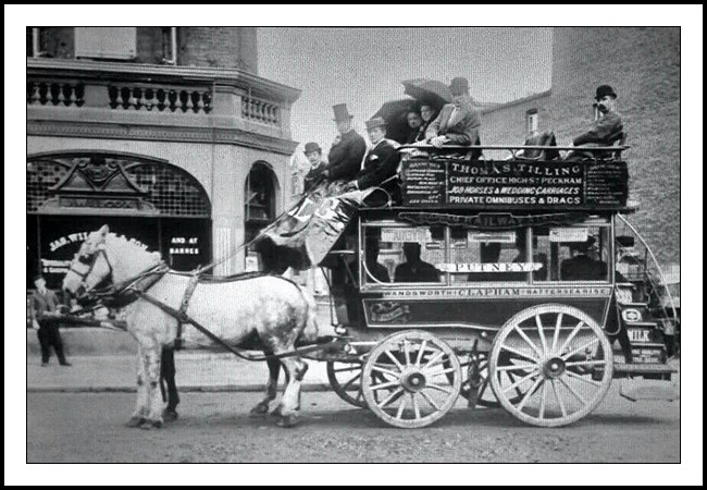 A vintage photograph of a two horse drawn omnibus which was routed between Clapham and Putney.
