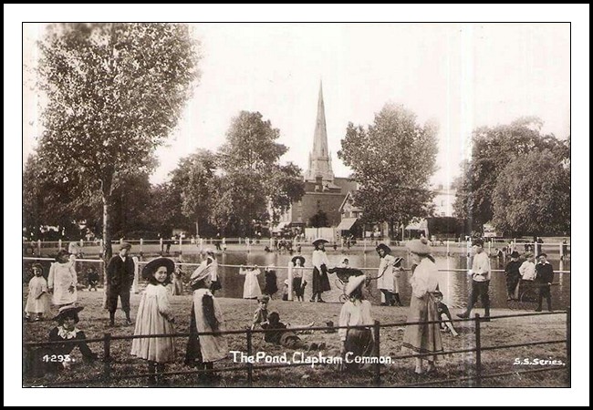 A photograph of a vintage postcard which depicts a Victorian scene looking across the pond at Clapham Common.